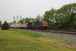 A CSX train under the cantilever signal bridge with 7504 leading